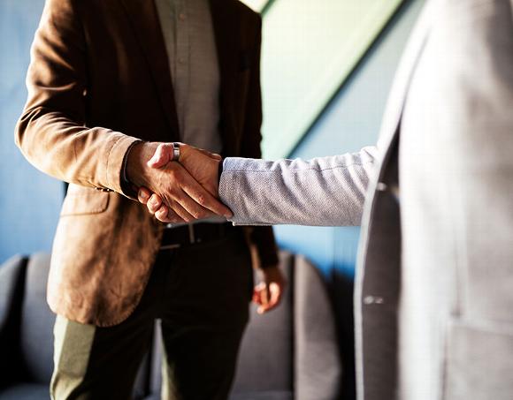 two men shaking hands